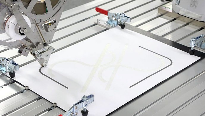 MELFA ASSISTA robot automates the application of double-sided tape in collaboration with workers