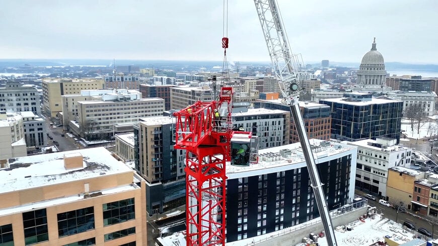 Potain tower cranes help transform Madison’s downtown skyline under an airport flight path