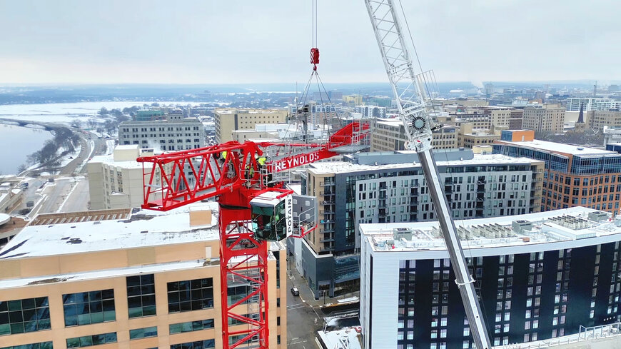 Potain tower cranes help transform Madison’s downtown skyline under an airport flight path